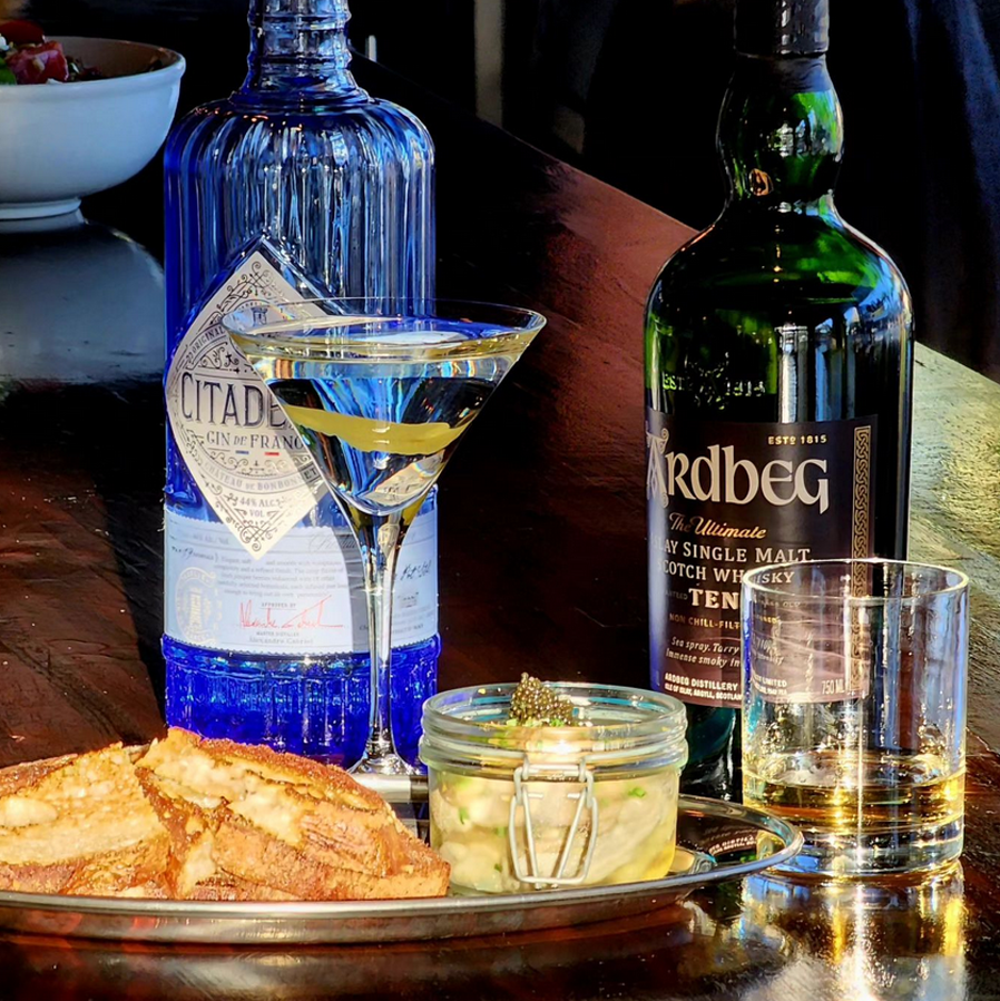 A Citadel martini and a finger of Ardbeg Scotch flanking a caviar appetizer.